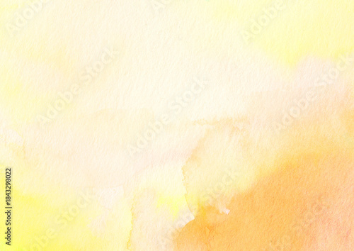 黄色とオレンジの水彩絵の具がにじむ背景テクスチャ