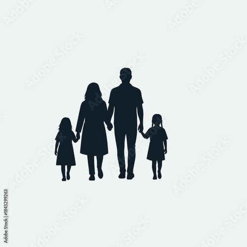 Family silhouettes walking hand in hand together.