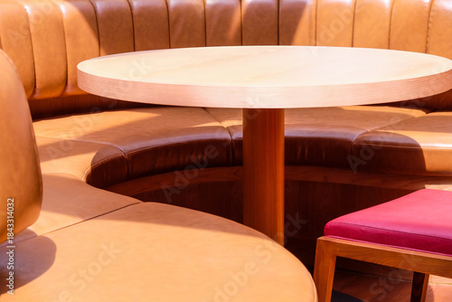 Wooden chairs and tables in a cafe, closeup of photo