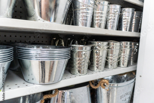 Fotografi Shelf Full of Shiny Galvanized Metal Buckets and Pots
