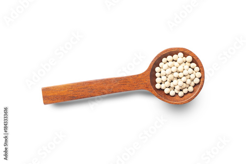 wooden spoon on white background, Dried white pepper seeds in brown wooden spoon isolated on white background top view clipping path