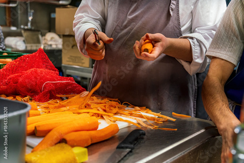 The Restaurant workers at the kitchen prepare the vegetables for dinner time