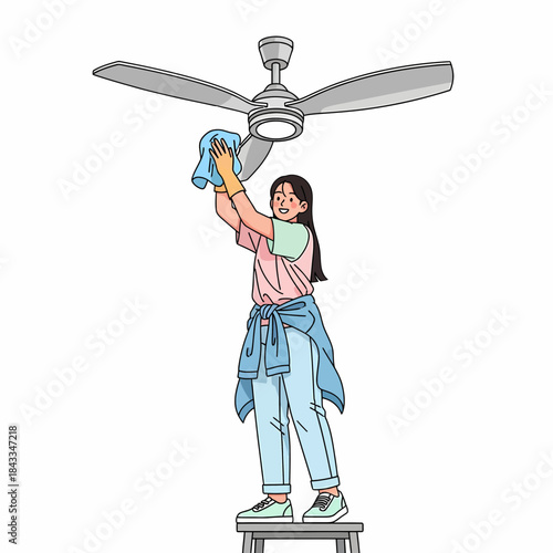 Woman Cleaning a Ceiling Fan with a Cloth While Standing on a Stool