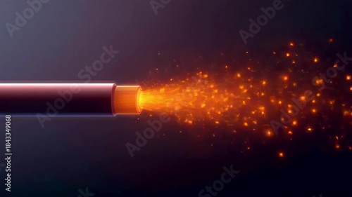 Glowing fiber optic cable emitting bright orange particles against dark background
