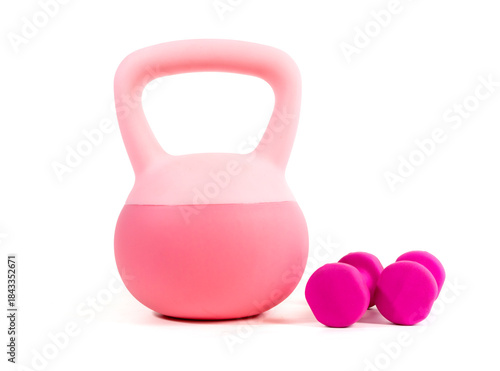 Pink kettlebell and dumbbells isolated on a white background. A stylish home gym set perfect for women's fitness and strength training concepts.