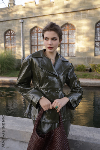  beautiful young slavic woman with long dark natural hair in elegant clothes