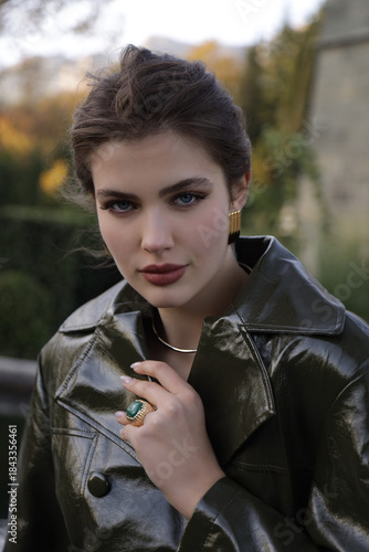  beautiful young slavic woman with long dark natural hair in elegant clothes