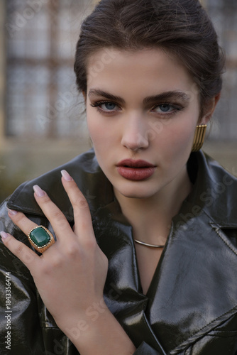  beautiful young slavic woman with long dark natural hair in elegant clothes