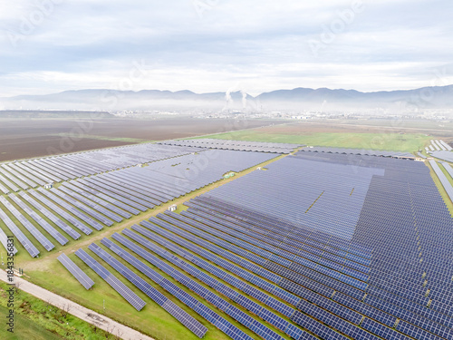 Quadro em tela Sustainable future versus industrial power generation, solar energy and factory