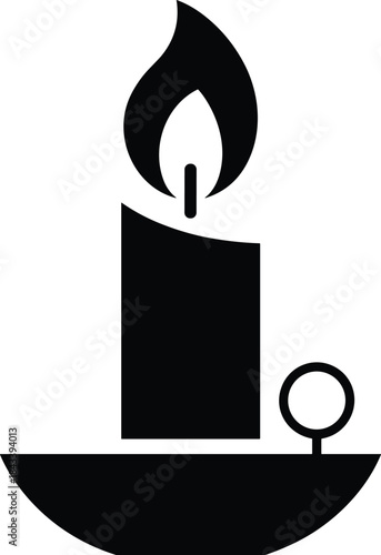 Black and white candle with flame and wick symbol