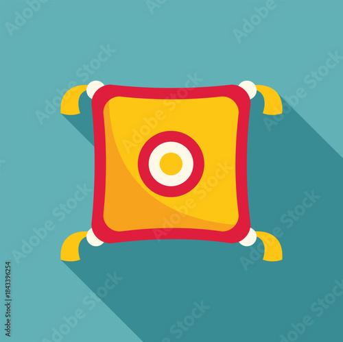Comfortable yellow tassel pillow with central red and white circle design resting on a turquoise background