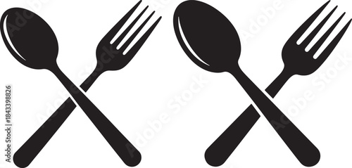 Two crossed spoons and forks silhouette