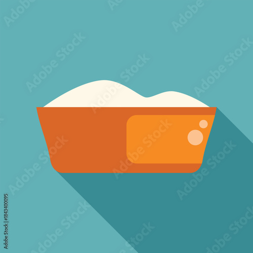 Orange laundry basin full of soap suds and water creating bubbles, with long shadow on a turquoise background