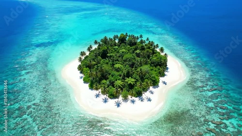 Aerial view of a lush tropical paradise island surrounded by vibrant turquoise ocean water and white sand beaches