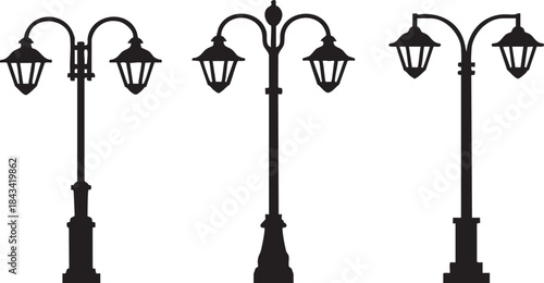 Three black vintage street lamps with lanterns on poles