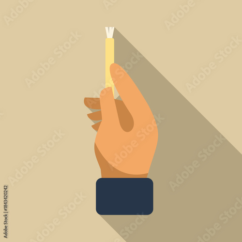 Hand holding miswak natural toothbrush for oral hygiene