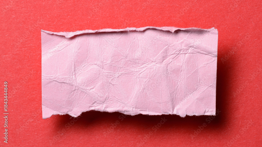 Obraz premium One single pink torn ripped wrinkled crumpled blank paper note with drop shadow, folded edge and copy space for text on background