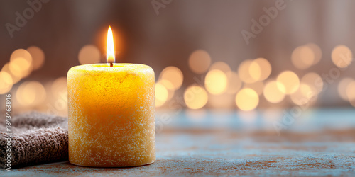soft glowing candle creating a serene warm atmosphere with a bright clean upper area offering ideal placement for wellness text content