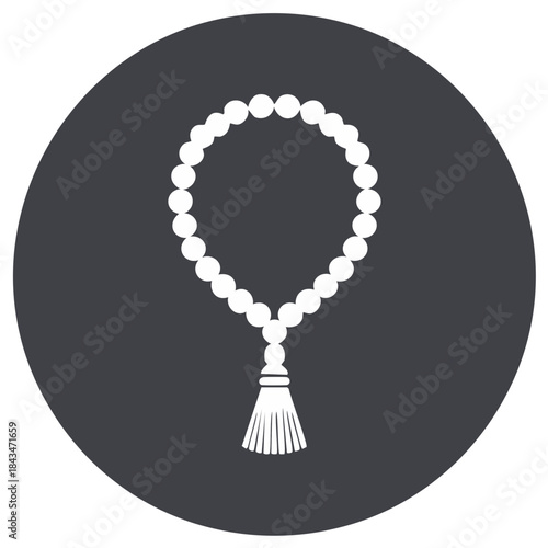 Islamic prayer beads counter with tassel on grey circle background. Tasbih, misbaha for zikr, meditation and religious rituals.