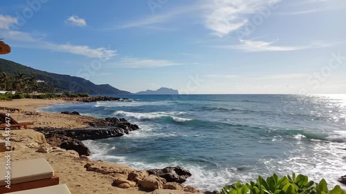 Coastal Beach Landscape Featuring Sun Umbrellas and Tranquil Ocean Under Bright Sky