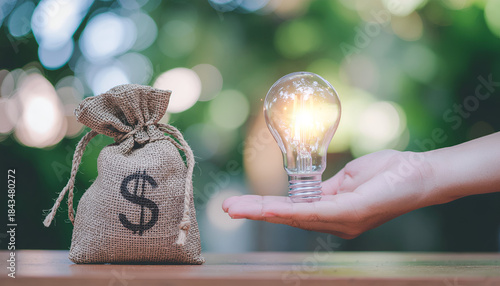 Idea monetization theme showing hands swapping a light bulb and a dollar bag.