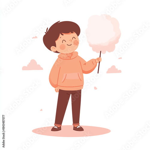 Happy boy holding pink cotton candy