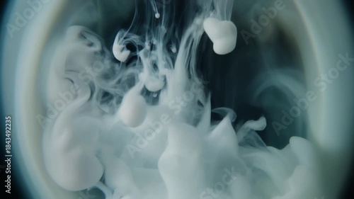 Light Ink Dispersing in Transparent Liquid Cinematic Abstract Fluid Motion Seamless 4K Loop