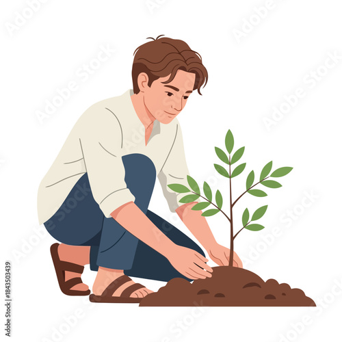 Young man planting a small tree, nurturing nature and growth
