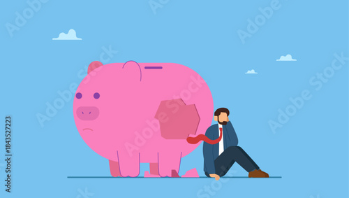 Depressed businessman sitting with broken piggy bank. Debt and loan problem, financial mistake, poverty or bankruptcy.