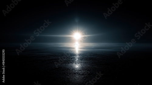 Fototapeta Naklejka Na Ścianę i Meble -  Dark sea surface with the sun's reflection in the center surrounded by darkness, conveying solitude, mystery, and hope