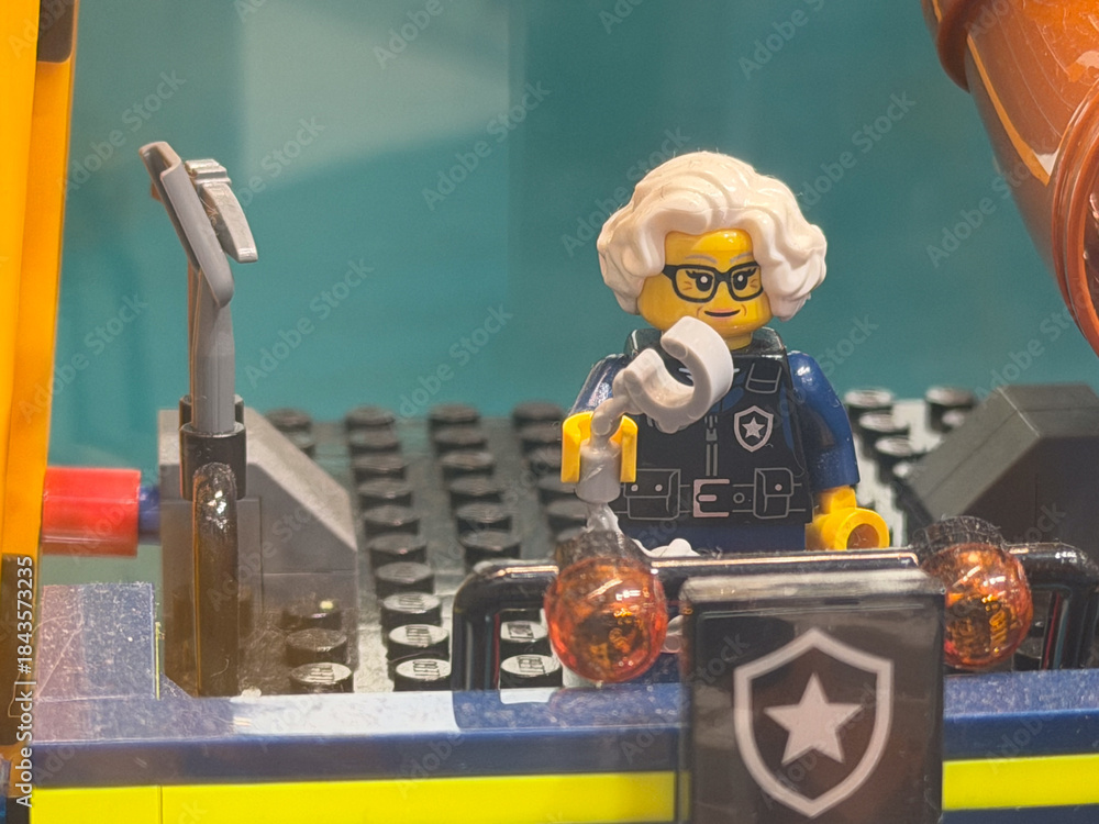 Fototapeta premium LEGO Police Officer Figure with Microphone