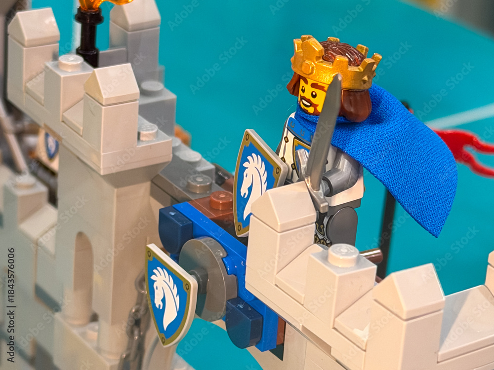 Fototapeta premium Lego king on castle wall with sword