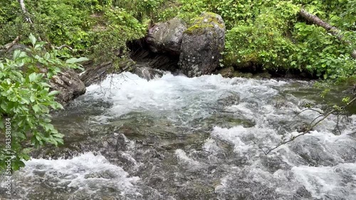 Water surfacing from the Underground powerfull into a creek