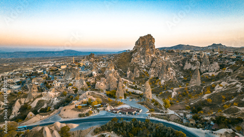 Tableau sur toile Cappadocia, Goreme, is revealed from a drone view showing fairy chimneys, carved valleys, ancient cave dwellings, and layered volcanic rock formations shaping the landscape from above