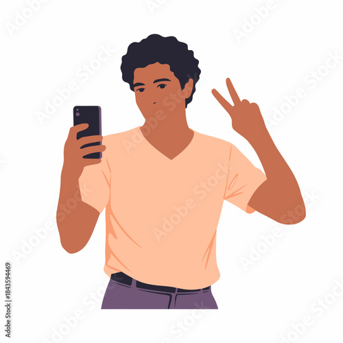 A confident young man stands taking a selfie while flashing a peace sign, capturing a moment of self-expression and enjoyment, exemplifying modern social interactions and youth culture.