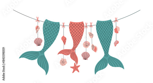 Three decorative mermaid tails hang from a rope with seashells starfish and other ocean charms creating a whimsical nautical display of seaside fantasy.