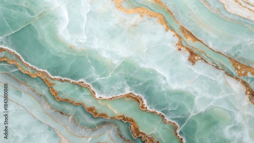 Exquisite light green onyx marble texture with golden veins, a captivating and versatile background for design and artistic endeavors