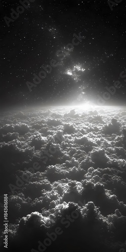 A breathtaking monochromatic view of the clouds and stars above, capturing the serene beauty of the cosmic expanse with ethereal light illuminating the clouds.