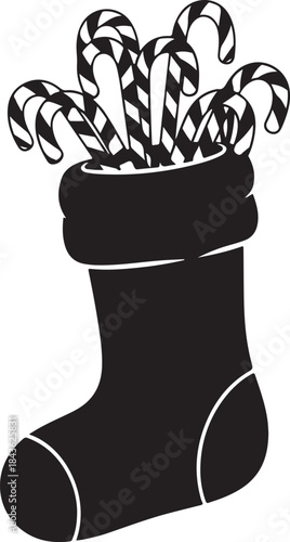 Black and white stocking filled with candy canes holiday Christmas