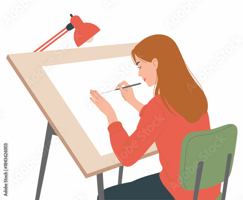 A talented young woman is focused on her artistic work at a spacious drawing table, showcasing her creativity and dedication to the craft of illustration and design.