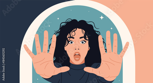 Frightened young woman with curly hair holds up her hands in a defensive 'stop' gesture, her face showing shock and fear.