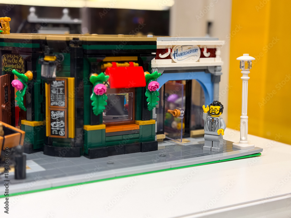 Fototapeta premium Colorful lego shop display with waving figure