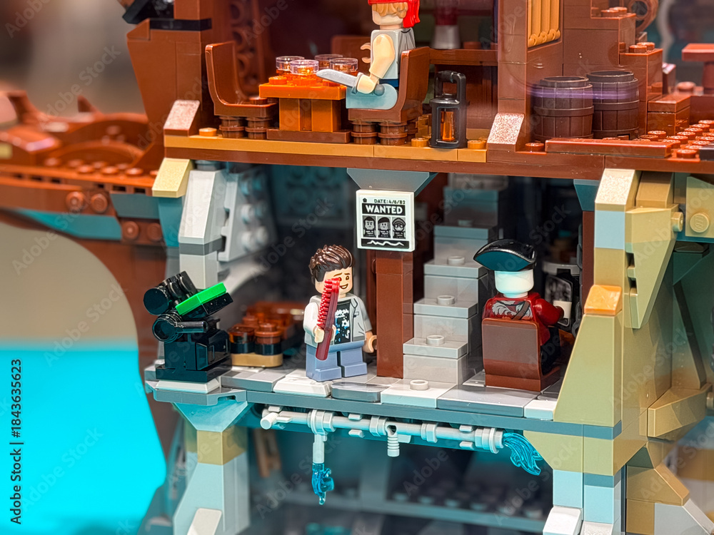 Fototapeta premium Pirate-themed lego scene with characters and wanted poster