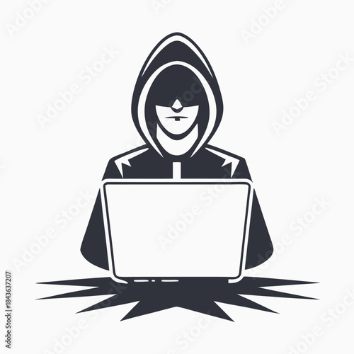 Silhouette hacker is using laptop wearing hooded jacket to commit cybercrime