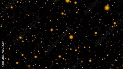 Blurred Golden circle pattern of Glowing Particles on Black Background.