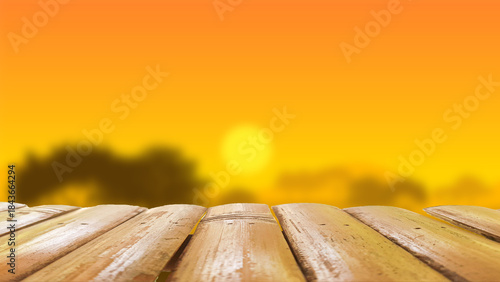 An illustration of a wooden table against a blurred sunset.