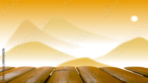 A wooden table with a blurred background of mountains and fog in winter.