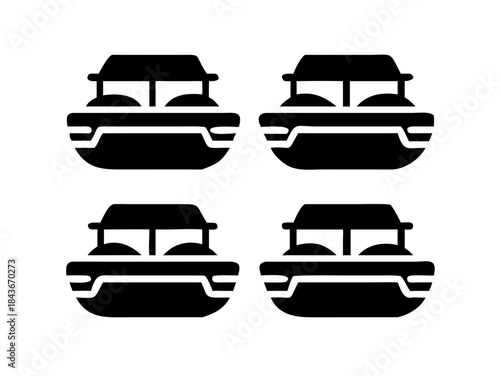 A close up of a black and white cat s face looking forward