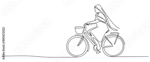 Woman Riding Bicycle on Open Road