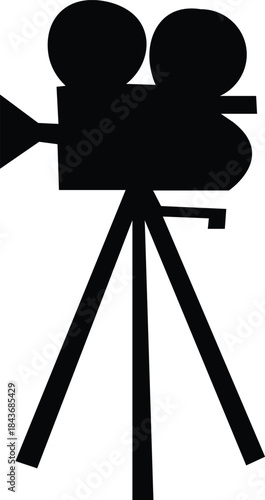 Silhouette of a vintage movie camera on a tripod